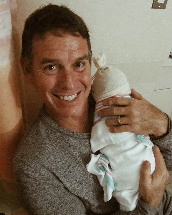 My dad holding Mehana for the first time