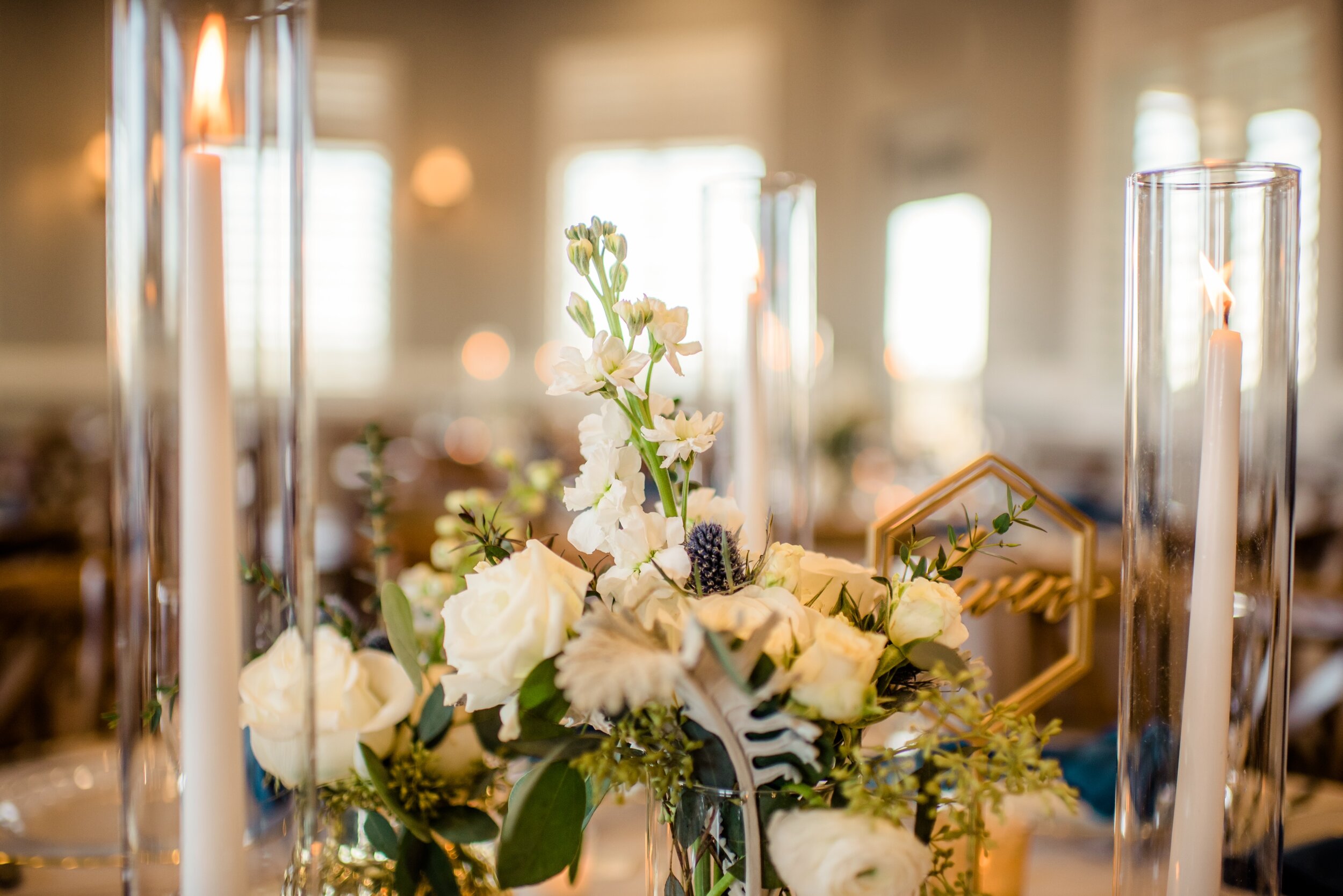 Textured Centerpieces with Blue Napkins and Gold Accent