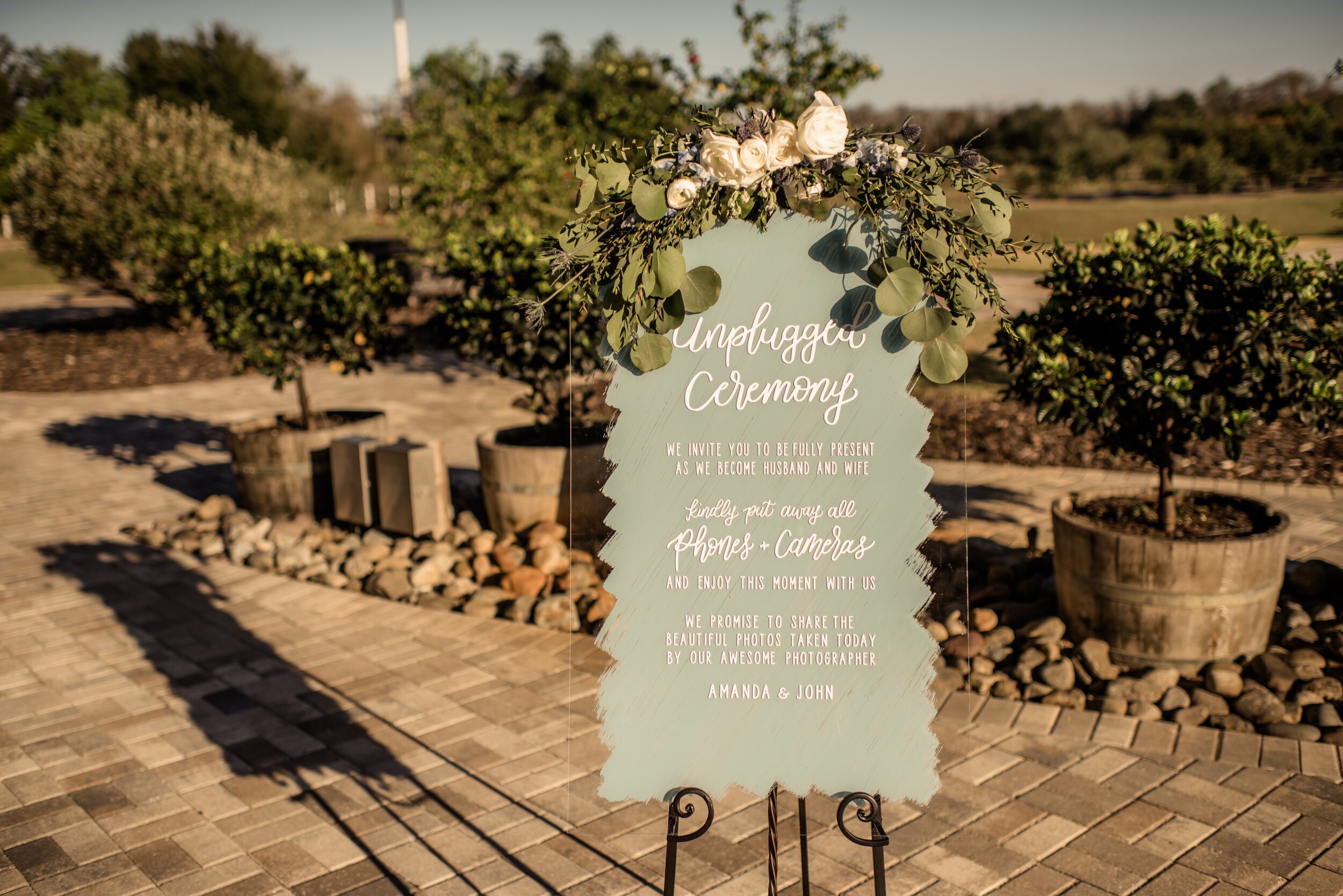 Simple greenery sign floral for the welcome sign before the ceremony