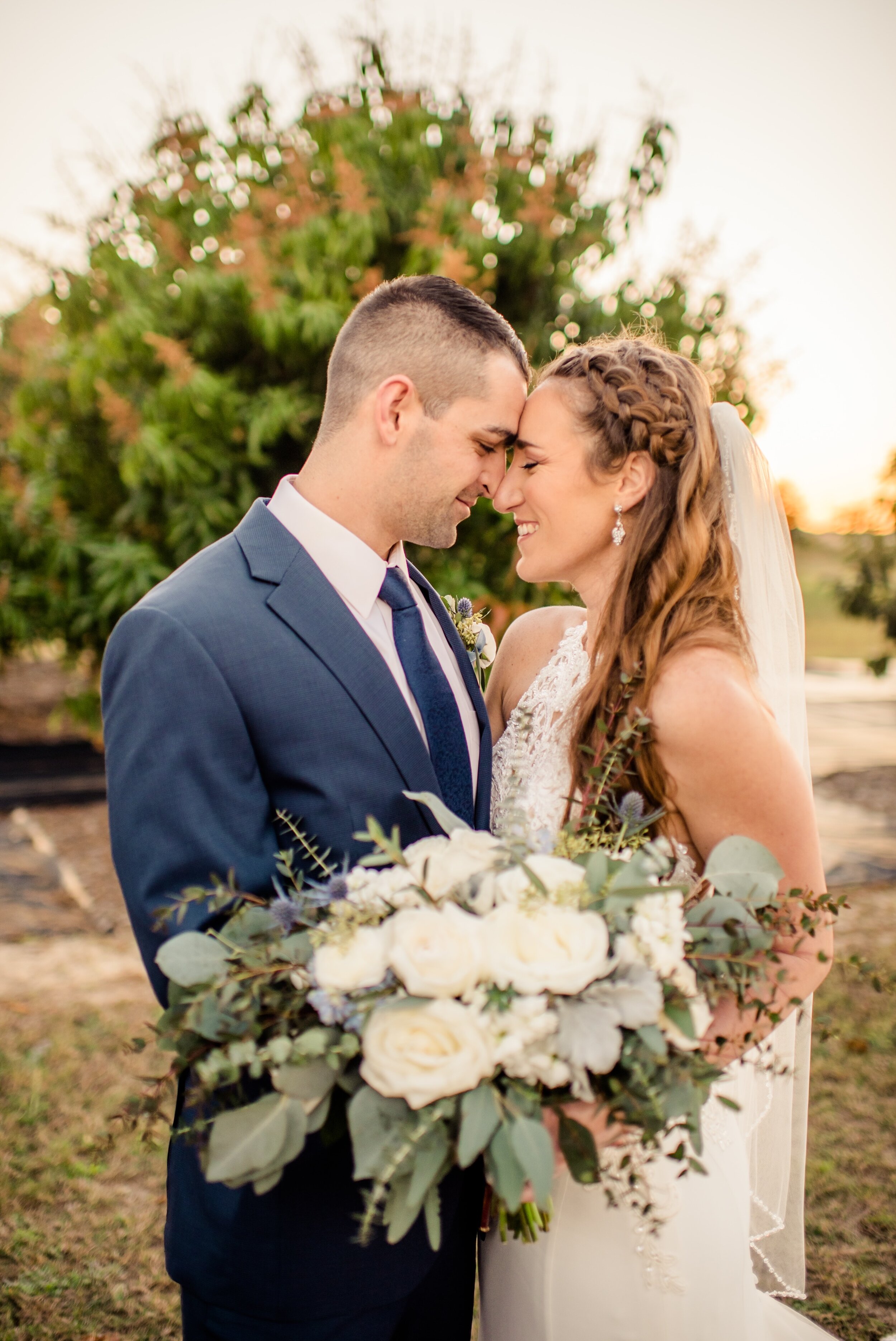 Stunning photo of bride and groom featuring bridal bouquet