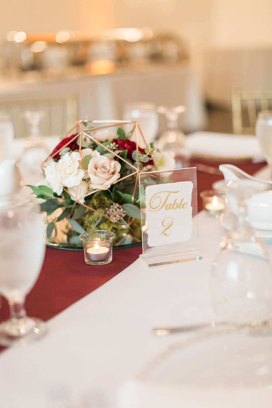 Bluegrass Chic - The Hendricks Photography at Royal Crest Room geometric shapes with floral as centerpieces and aisle markers