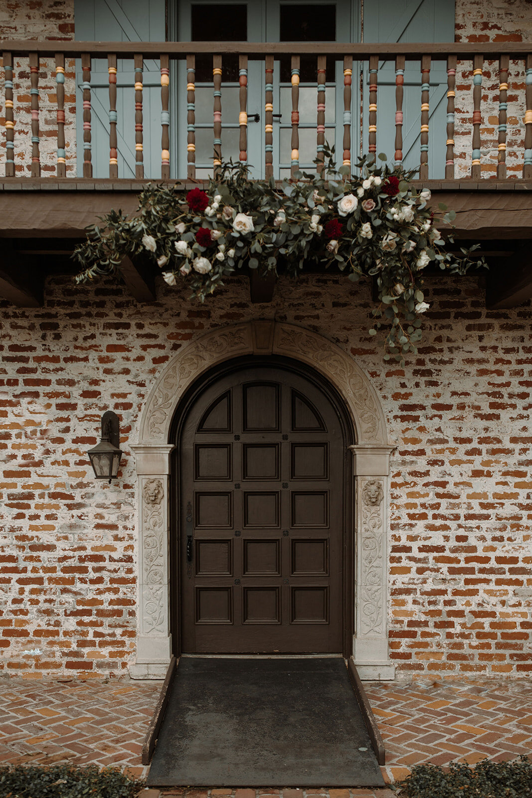 Bluegrass Chic, The Ferros, Casa Feliz Floral arch hanging above door