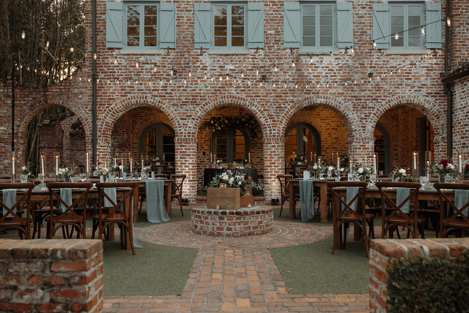 Bluegrass Chic, The Ferros, Casa Feliz Reception set in the courtyard with farm tables and beautiful runners