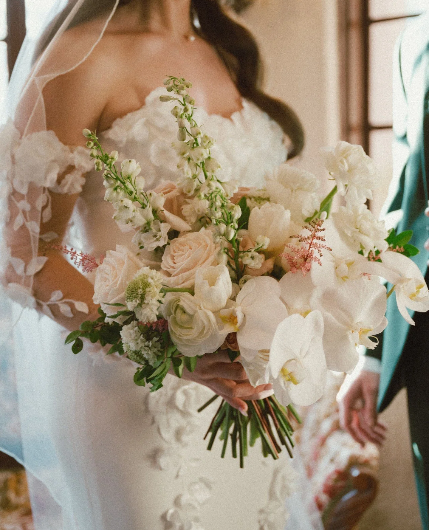 your bridal bouquet✨️ with you every step of the way on your big day!⁠
⁠
Megan's bouquet was an absolute DREAM - with delicate astilbe and scabiosa paired with elegant orchids and delphinium - a match made in heaven!⁠
⁠
Double tap and comment to show