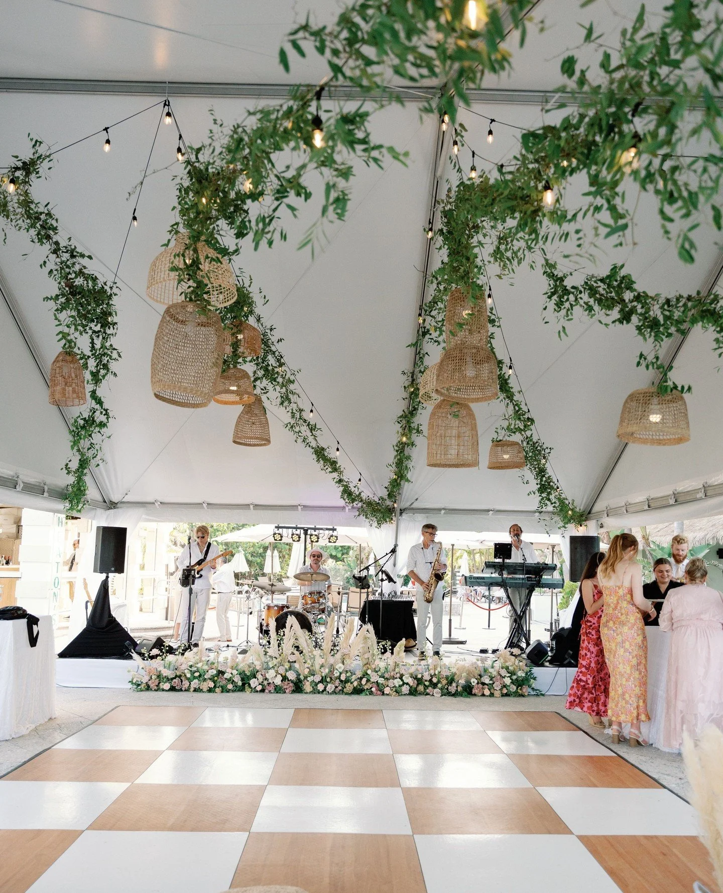 the dreamiest tent!🌿 Greenery vines &amp; rattan lanterns came together beautifully for this ceiling installation!⁠
⁠
Swipe to see how this organic installation totally transformed the space! Are you looking for a tent installation like this? We can