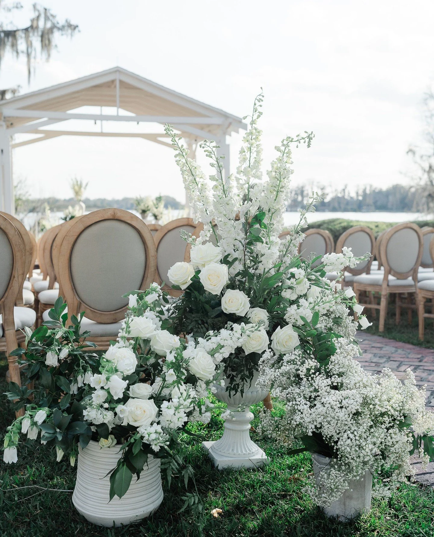 ✨️start of the aisle✨️ we LOVE dressing up the start of the aisle for a wow moment like this!⁠
⁠
Swipe to see these stunning trios at the start of the aisle!🤍⁠
-⁠
-⁠
#weddingflowers #weddingflorist #orlandowedding #orlandoflorist #luxurywedding #cyp