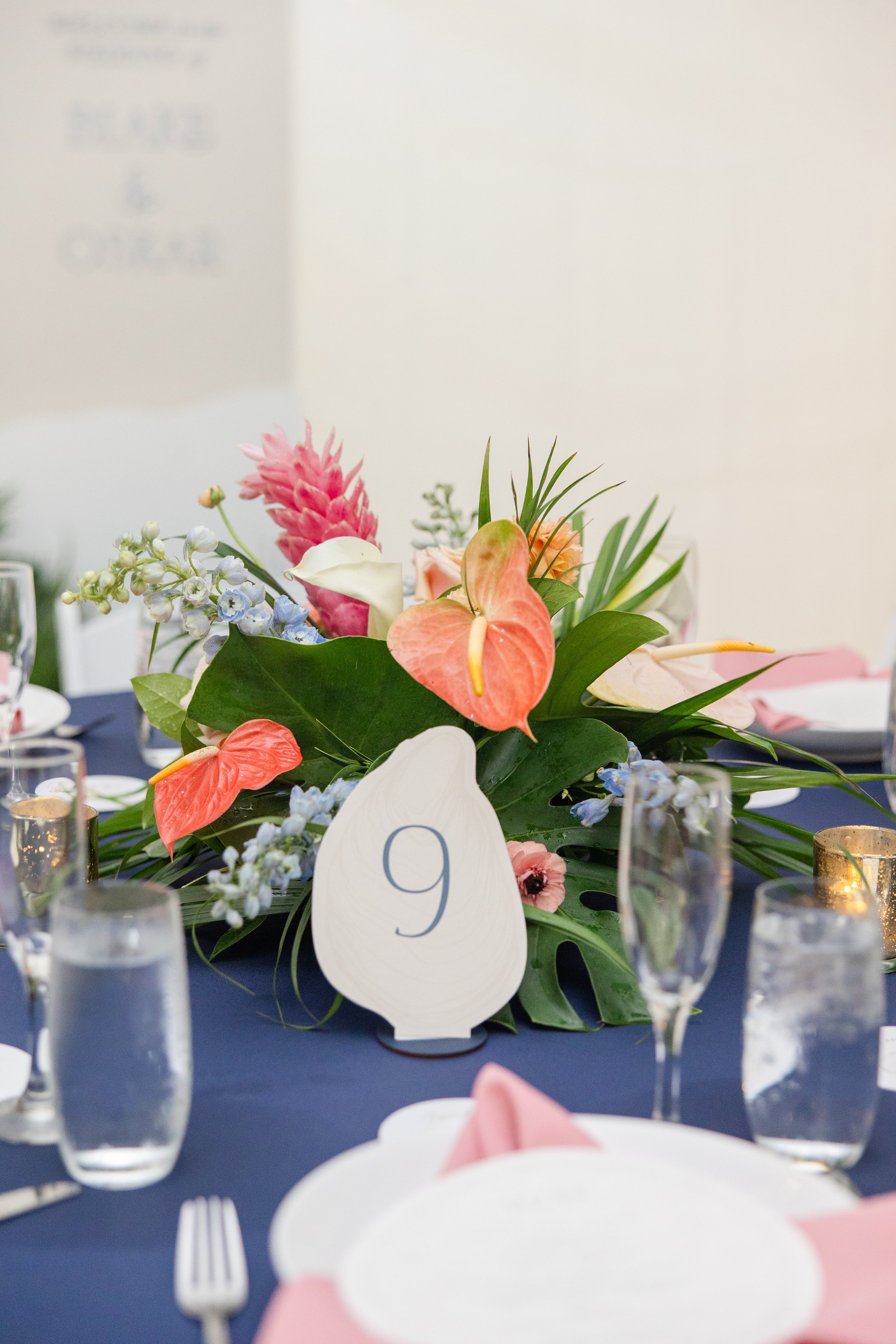 Tropical low floral arrangement designed for a lunch or dinner table setting, created by Bluegrass Chic, an Orlando event florist.