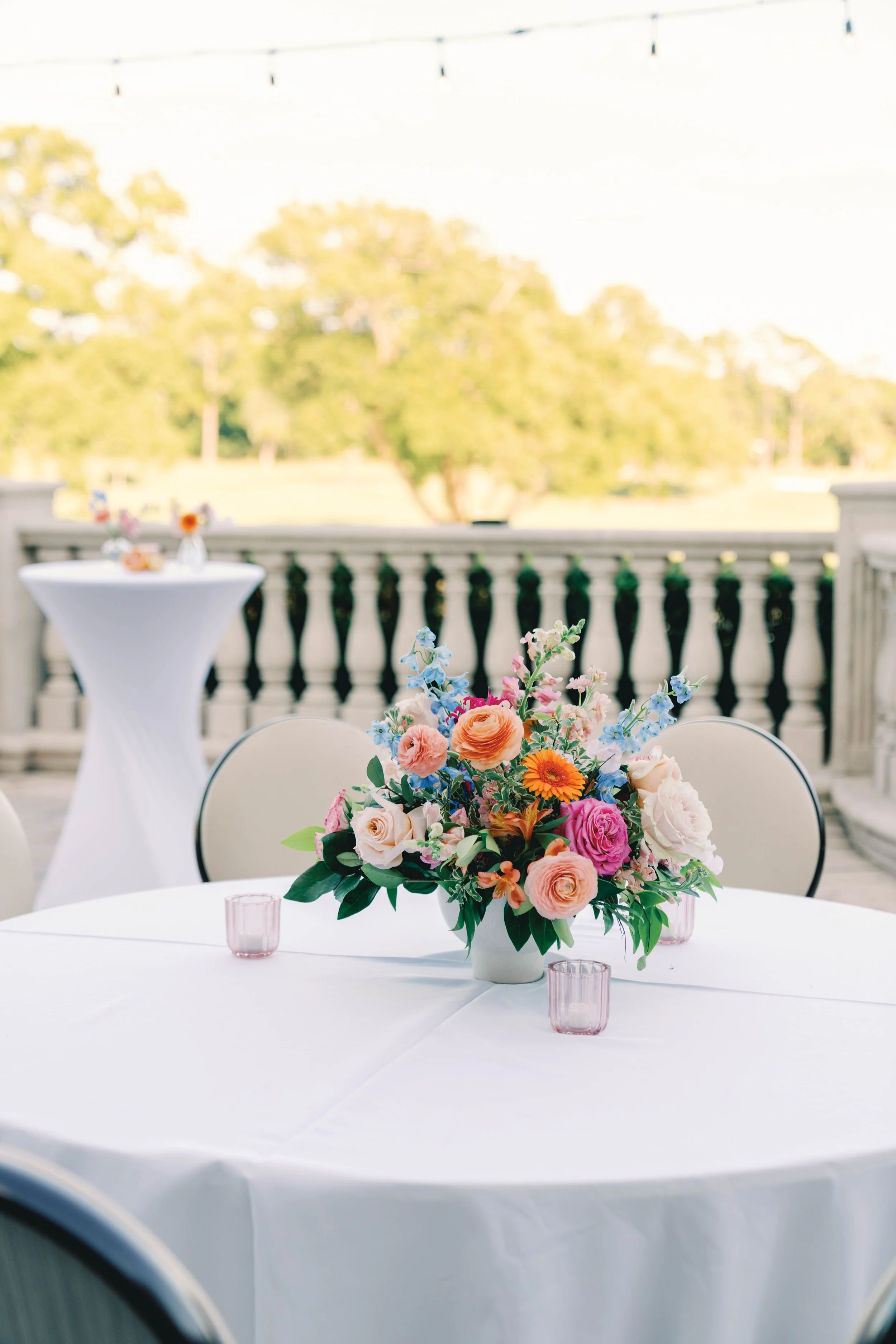 Elegant compote floral arrangement designed for an event table, created by Bluegrass Chic, an Orlando event florist.