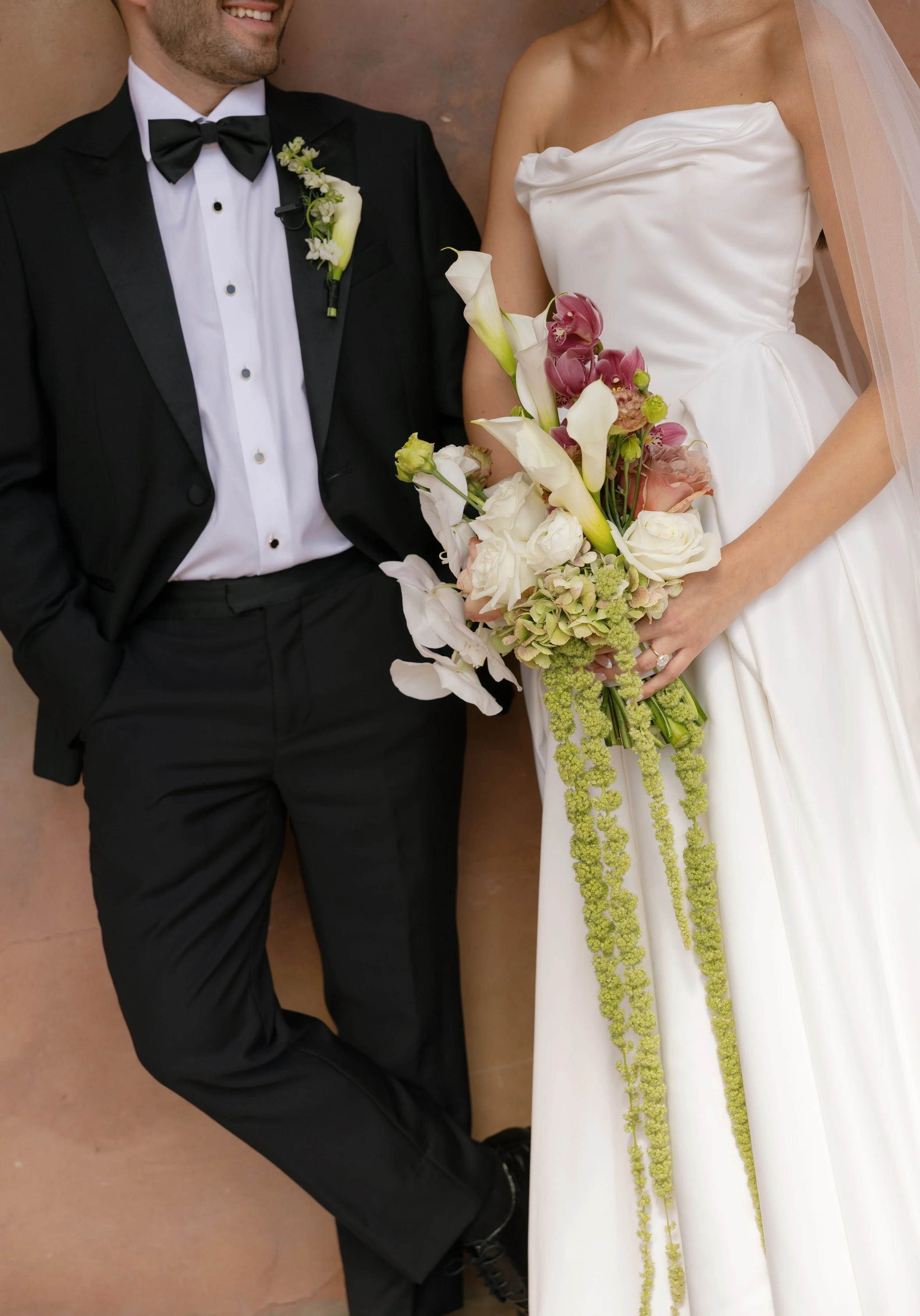 Bridal bouquet with roses, calla lillies, orchids, and amaranthus design by Bluegrass Chic, an Orlando wedding florist