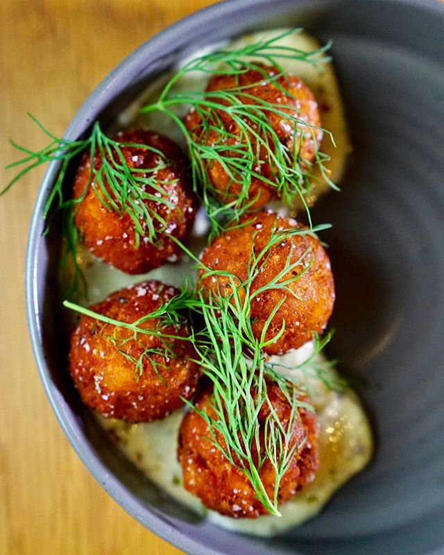 Delicious salt cod croquettes from @restaurantnorman, really cool new-ish Greenpoint spot serving Nordic fare in a HUUUUUUGE space😱It doubles as a 23,000 sq foot coworking apace, like wework, but anyone can come at any time for free. The video I sho