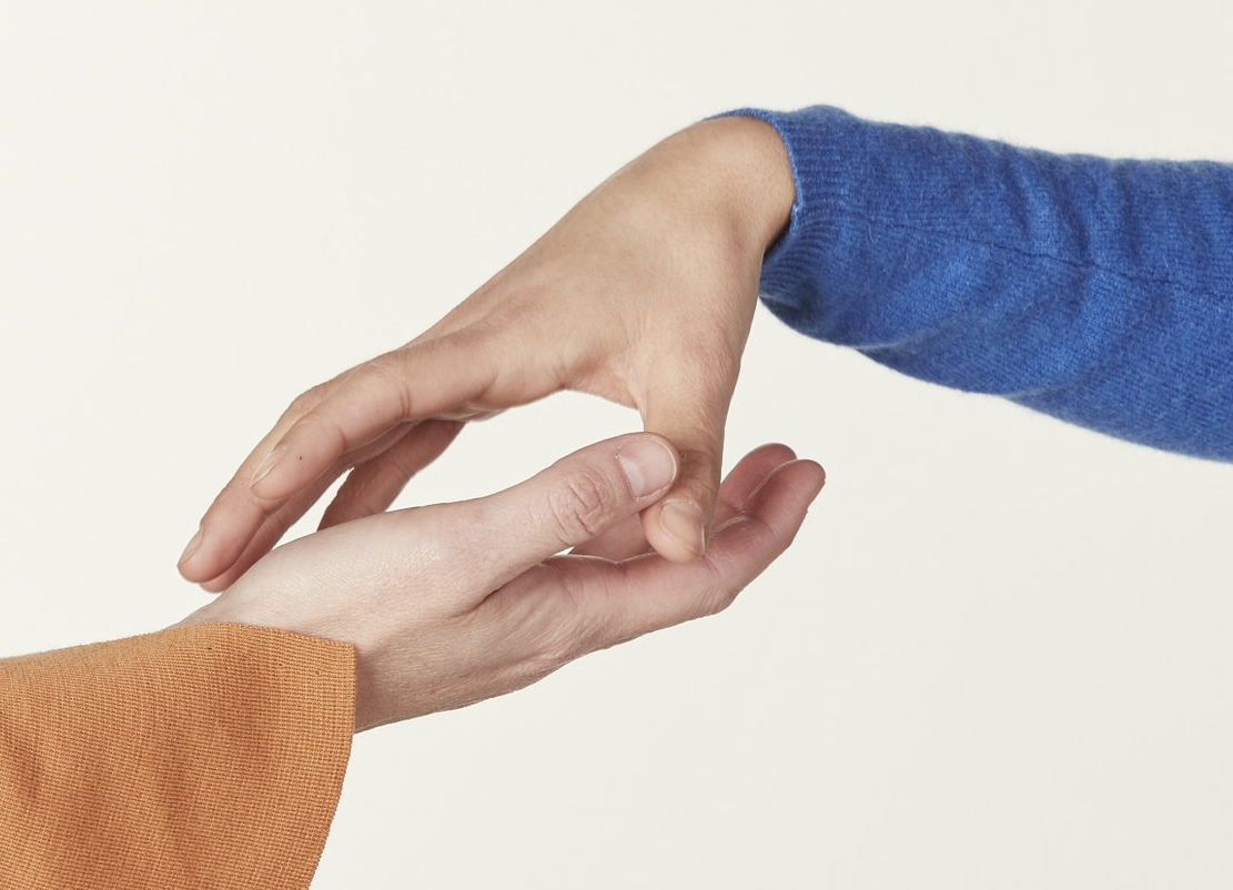 two hands touching to symbolise communication.jpg