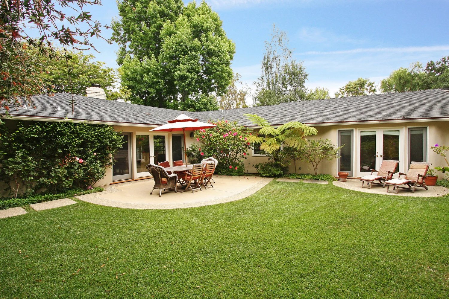 1075 Angelo Drive | Beverly Hills Listed at $2,450,000 Location, location! Prime lower Angelo Drive. Lovely one-story remodeled home. High ceilings, hardwood floors, convertible den, and wood-burning fireplace. Gourmet cooks kitchen with granite counter tops. Large master suite with marble bath and ample walk-in closet. There is another 2 bedrooms. French doors lead to large grassy yard with room for a pool. Attached 2-car garage with direct entry. A rare find!