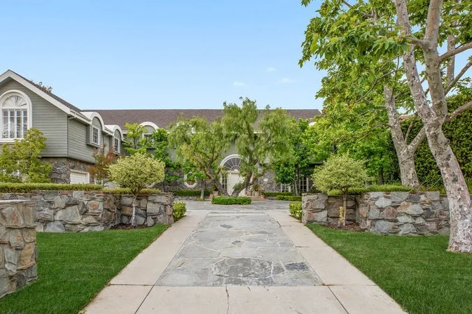 3378 Stone Ridge Lane | Bel-Air Listed at $8,995,000 Located in the exclusive 24-hour guard gated enclave of Stoneridge Estates, this stately Traditional Home features enormous scale and volume throughout. Picture perfect front yard with stone driveway. Grand entry with sweeping staircase. Sports court and citrus grove, all overlooking stunning views. Rare opportunity to own an estate of this magnitude in a prestigious gated community.