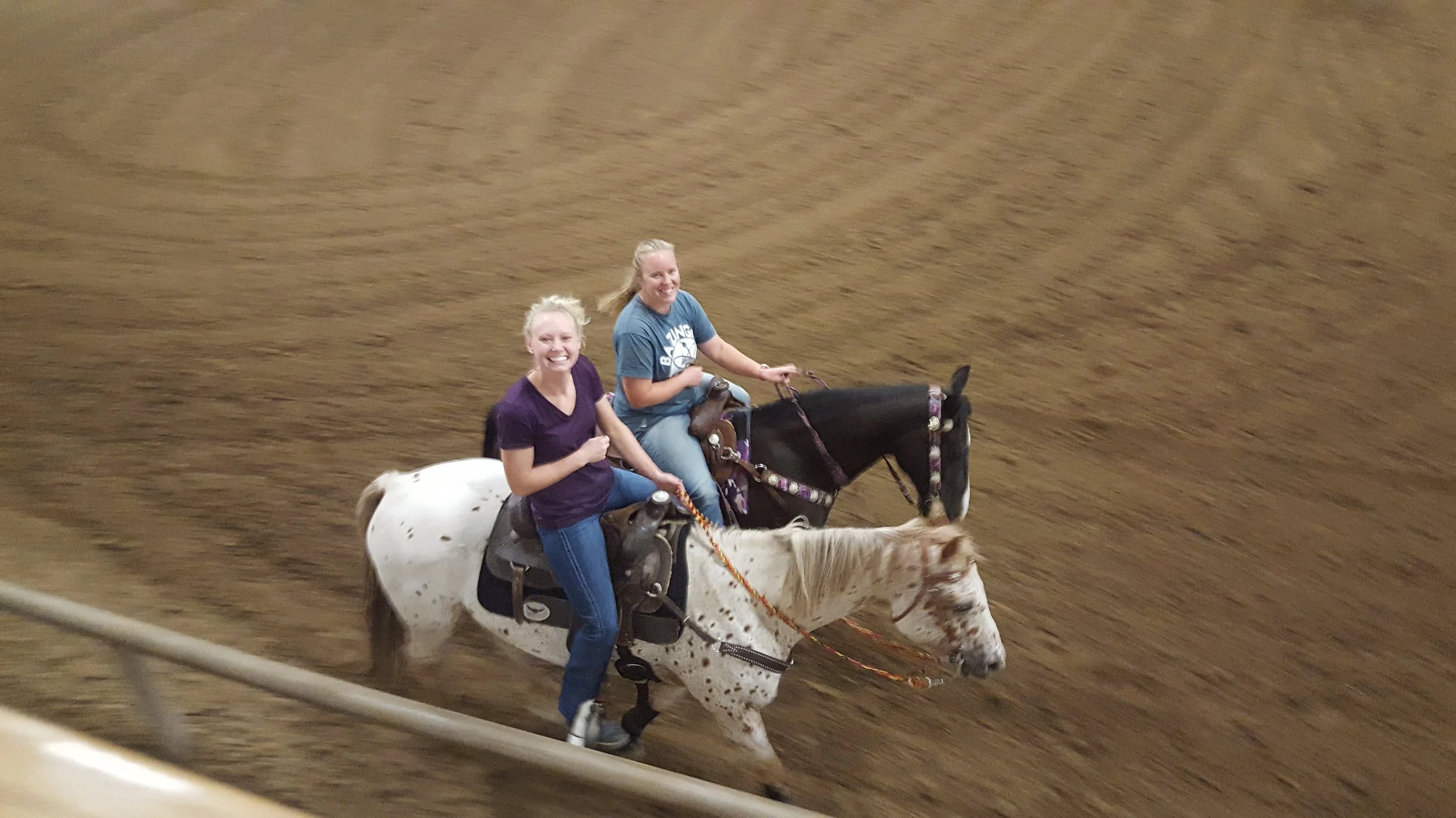 Alumni Angela Robertson (left) and Krista Goosman (right) warm up before their ride