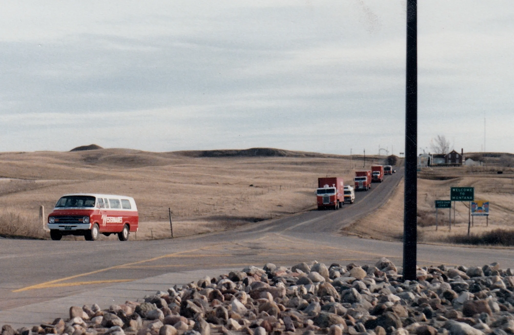 The Westernaires convoy heads southbound across the Canadian/U.S. border and into Montana, March of 1986. Border agents (who were likely unaccustomed to seeing dozens of teenagers and their horses crossing the border) decided to be a bit difficult and required that every horse be unloaded from the horse vans. Satisfied after their inspection, the horses were quickly reloaded. The border agents were reportedly “amazed" at the organization and ease by which the Westernaires could load their horses onto the semis.