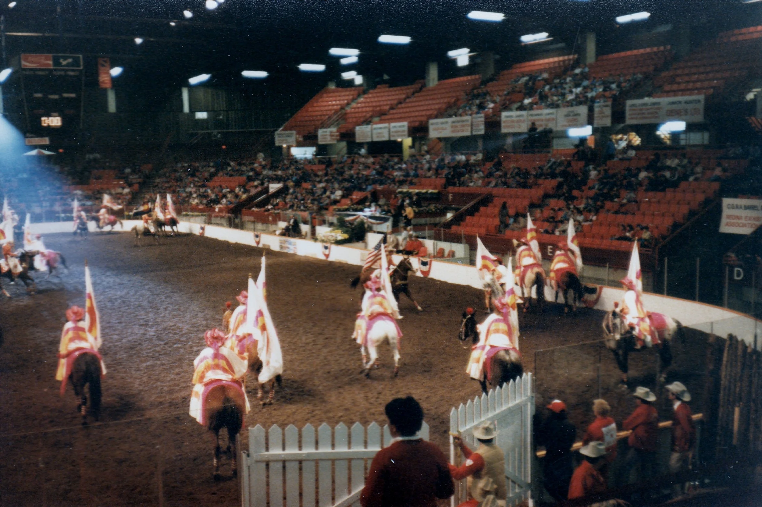 The Varsity Red Team sets up for the "Starburst" maneuver during one of their nightly performances at the Regina Horse Show, 1986