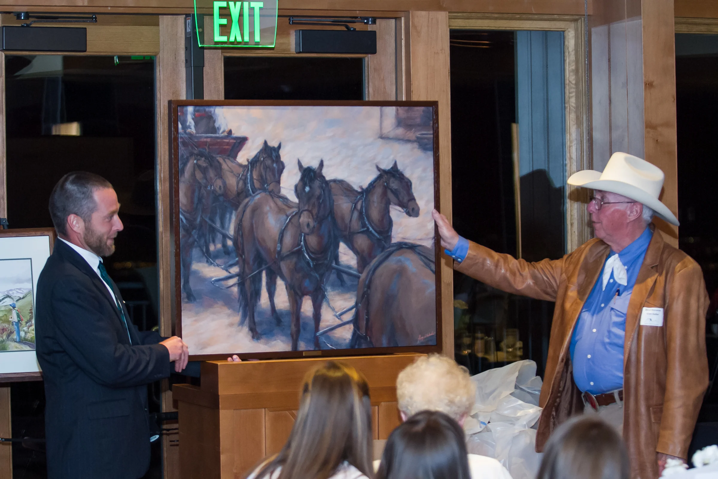 Alumnus Greg Whitaker and Director Glen E. Keller, Jr. with Greg's art portraying a matched team of horses.