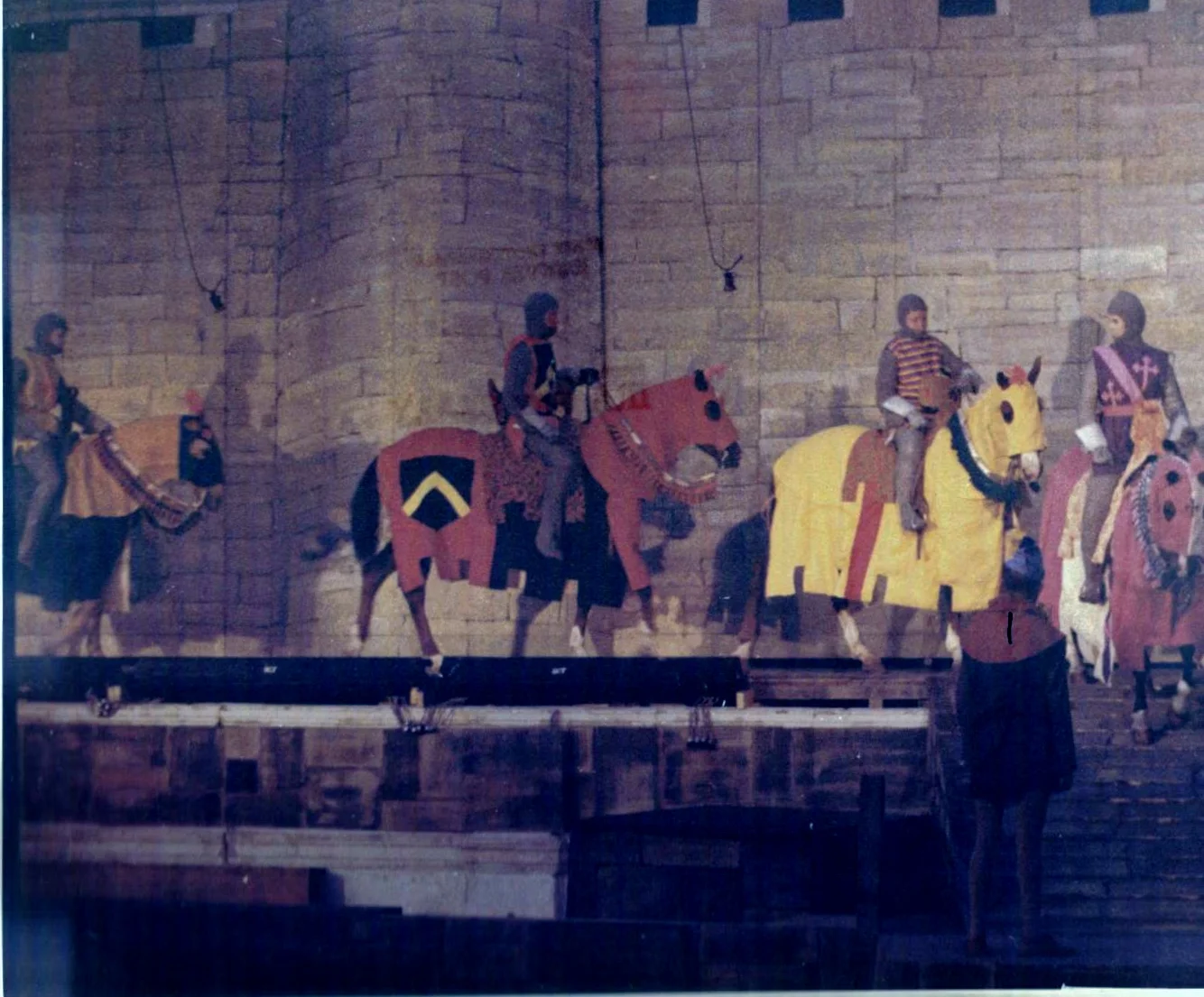 Westernaires riding across the narrow ramps criss-crossing the stage of Camelot