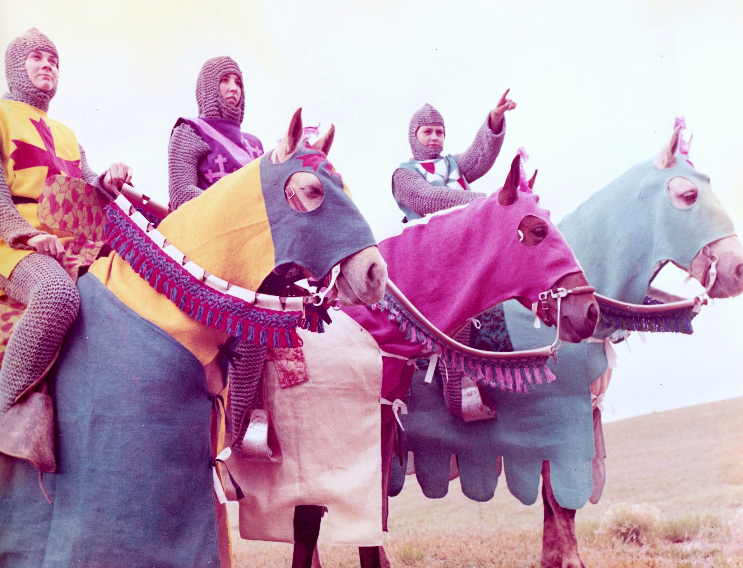 Westernaires riders Lib Clement, Mari Stannard, and Sharon Easley on Green Mountain in their Camelot costumes. In this shot one can see the detailed work that went into designing the jousting saddles, rider costuming, and horse costuming.