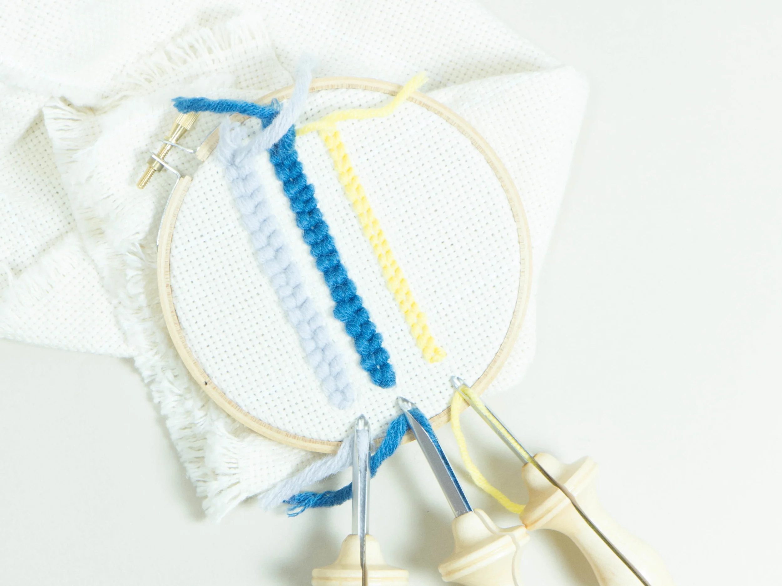 From left to right: #10 Regular with light blue yarn, #9 Regular with blue yarn, #10 Fine with yellow yarn.
