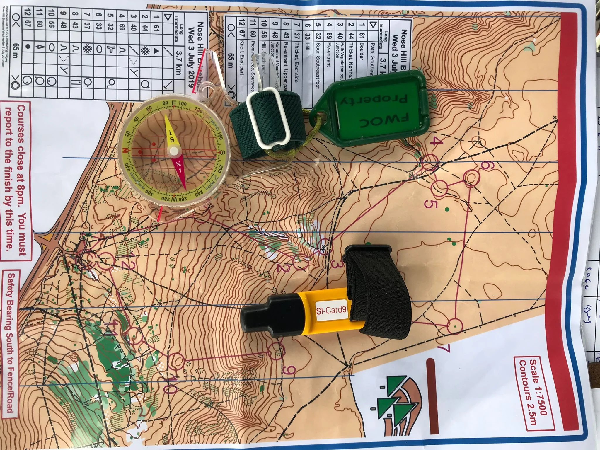 My Orienteering gear (compass, finger stick and my map)