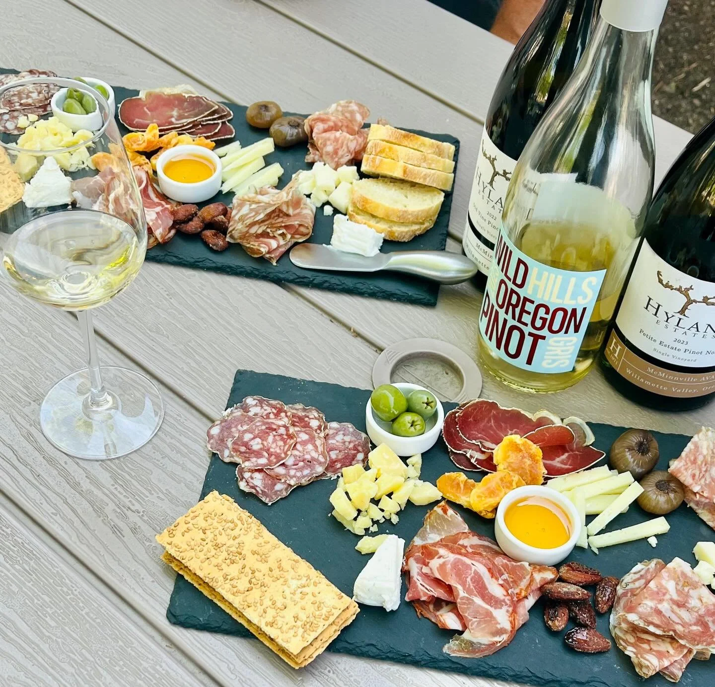 Sunshine in a glass meets classic Oregon elegance 🍷✨

Wild Hills Pinot Gris shines with bright citrus, crisp orchard fruit, and refreshing acidity, bringing a lively lift to the board. Hyland Estate Pinot Noir offers silky texture with layered red f