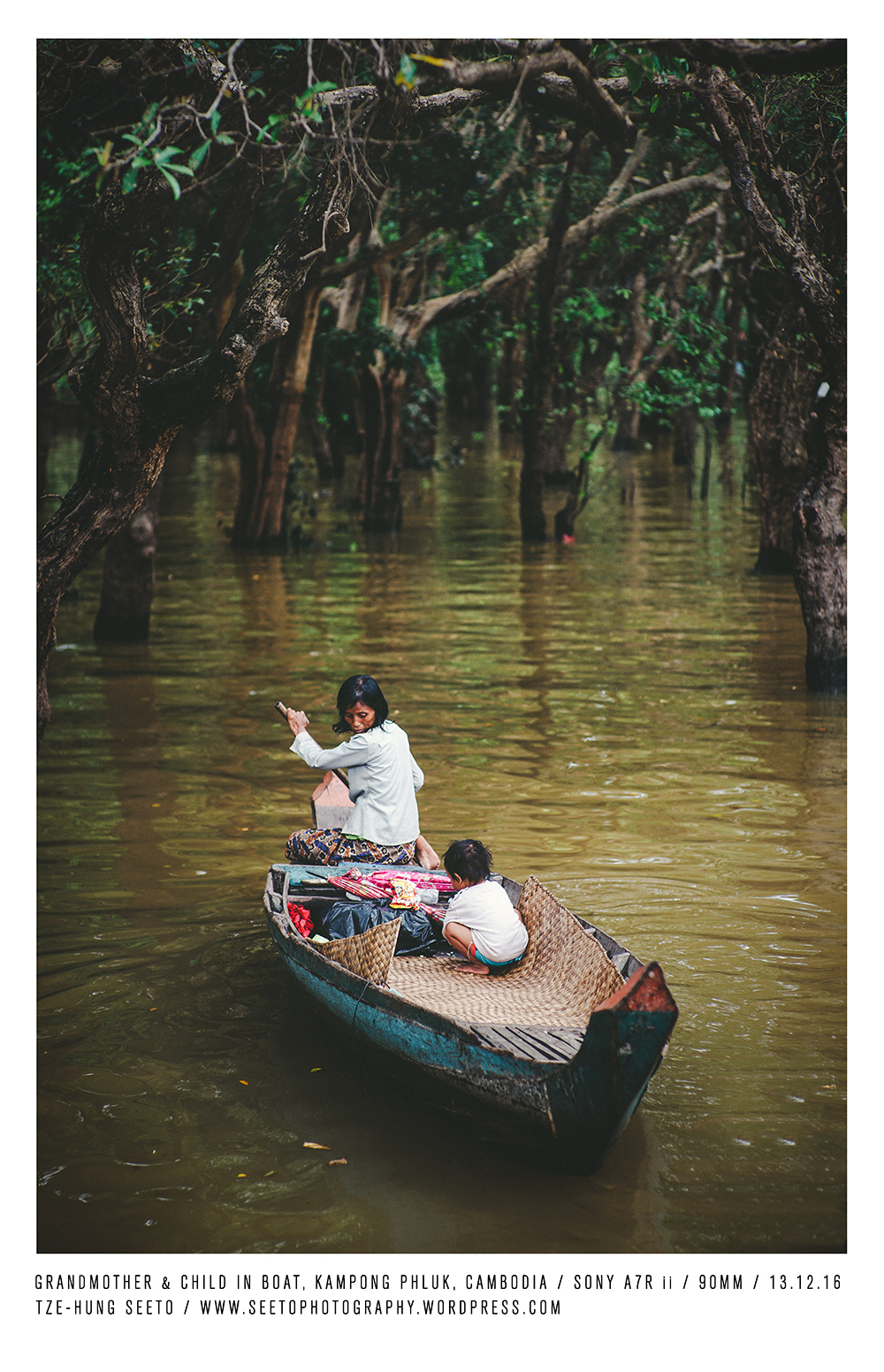 Cambodia, Kampong Phluk, Grandmother & child in Boat_CP.jpg