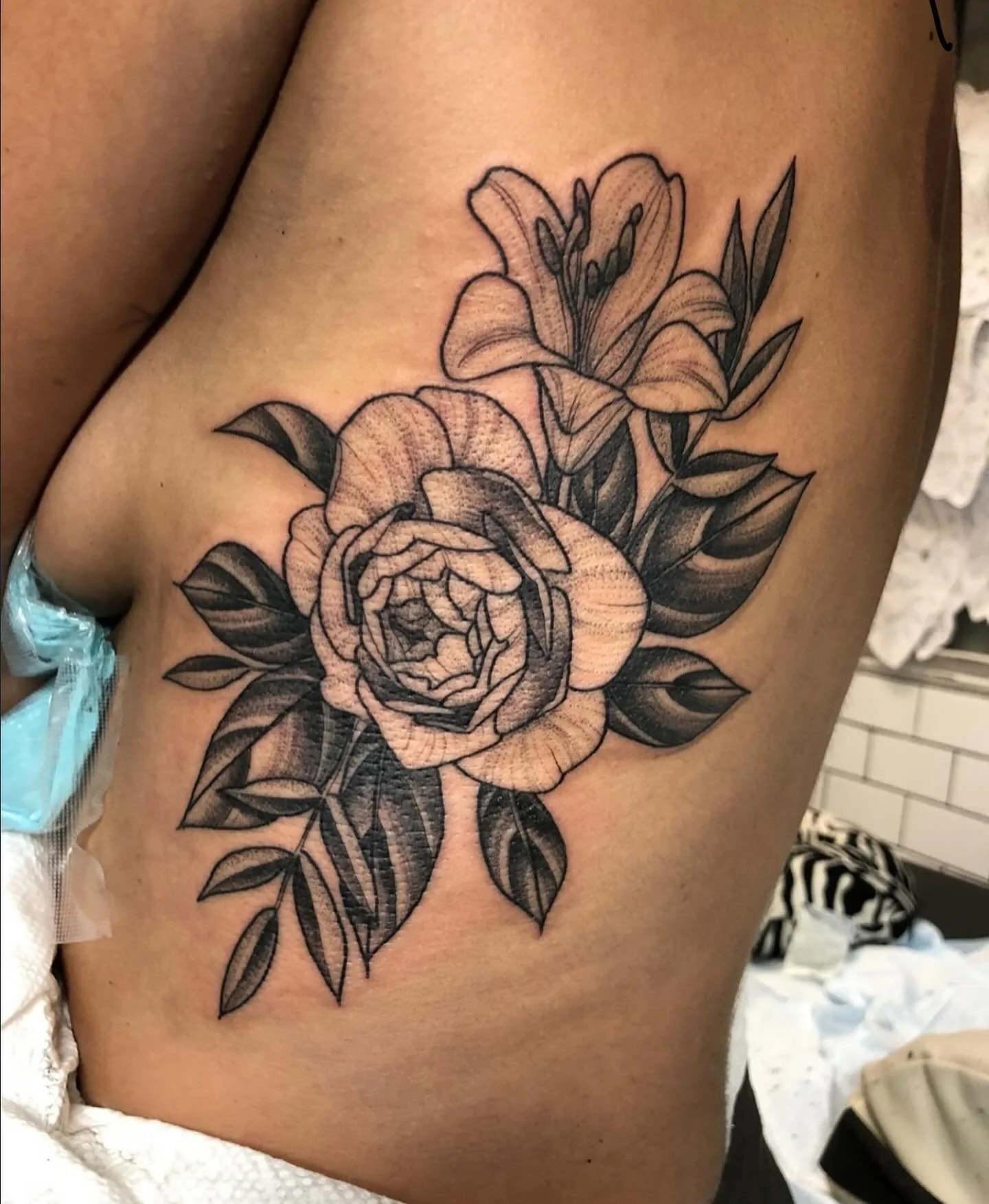 A floral piece of a rose and lily from @amandatattoos ✨ Head into the studio on a Friday for Amanda&rsquo;s walk ins or reach out to her directly to book in for December! 
.
.
#threekingstattoo #3KLDN #threekingslondon #3K #tattoo #tattooing #london 