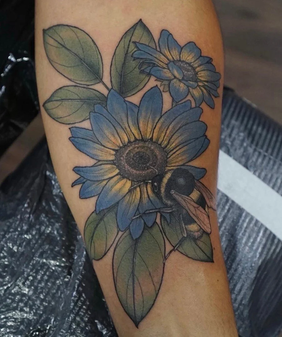 lil bunch of blue sunflowers from @amandatattoos ✨ Amanda is on walk ins every Friday, or drop her an email to book in for custom work throughout January! 
.
.
#threekingstattoo #3KLDN #threekingslondon #3K #tattoo #tattooing #london #deptford #brock