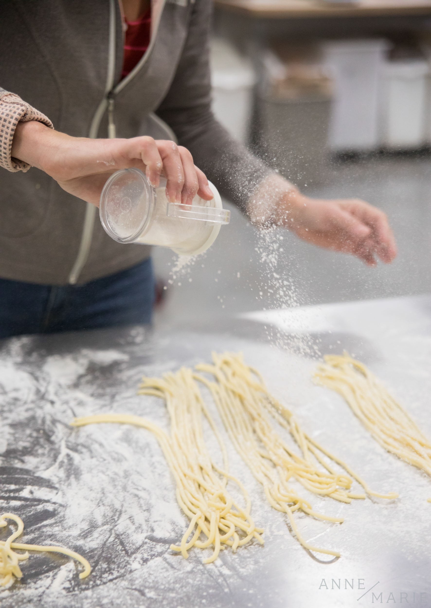  Katie flours the pasta so it doesn't stick together. 