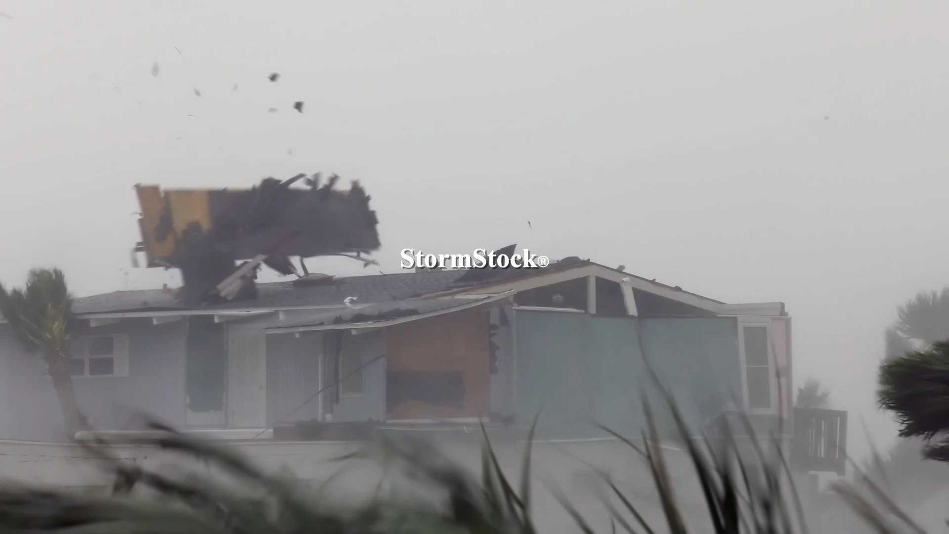 Roof rips from a home as intense winds from Hurricane Michael batter the Florida Coast