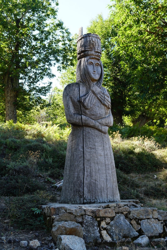 Wooden Statue Alongside the Trail