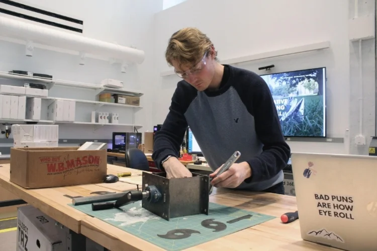Image 5: Matt Bell attaching hand crank to shredder