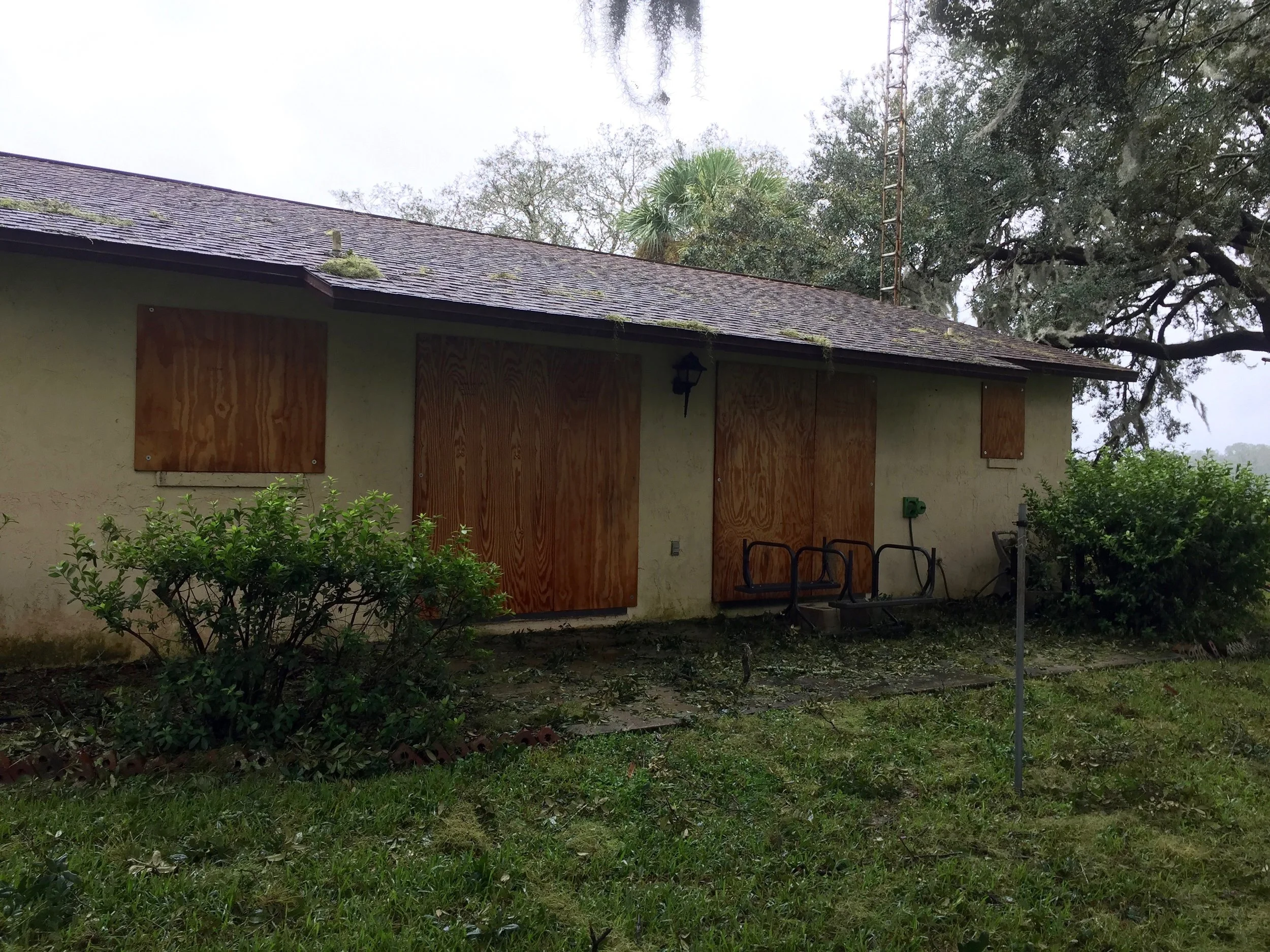 The Marston back porch, with a picnic table placed upside down for safety, Monday morning after Hurricane Irma. (Glenn Marston)