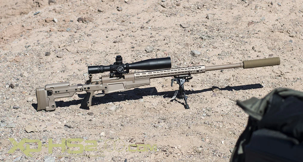 I did not get the model, but this is an Armalite rifle in 300win mag suppressed and toped off with a Night Force scope.