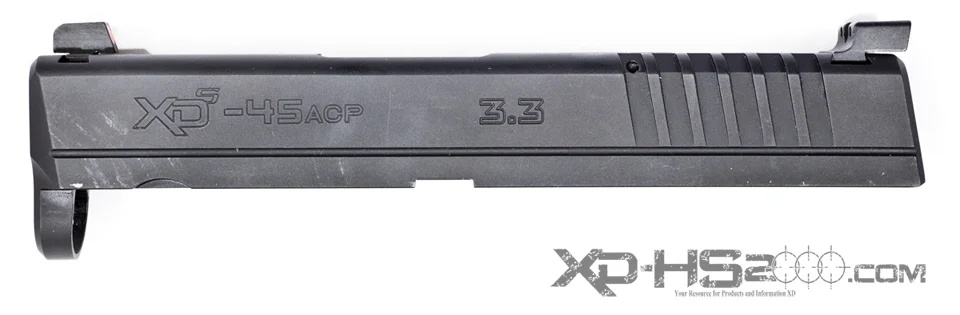 The slide of a Springfield Armory XDS pistol with the Trijicon HD sight set installed. Model number SP101O/SP101Y Orange/Yellow. They do not look right on the small XDS Slide. 