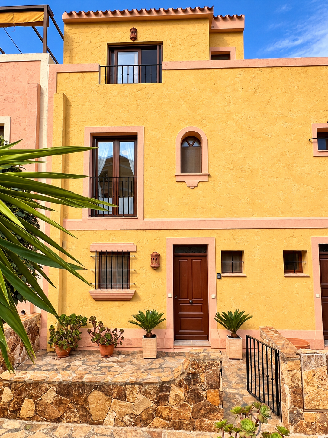 Sunlit Mediterranean Townhouse Facade (1).png
