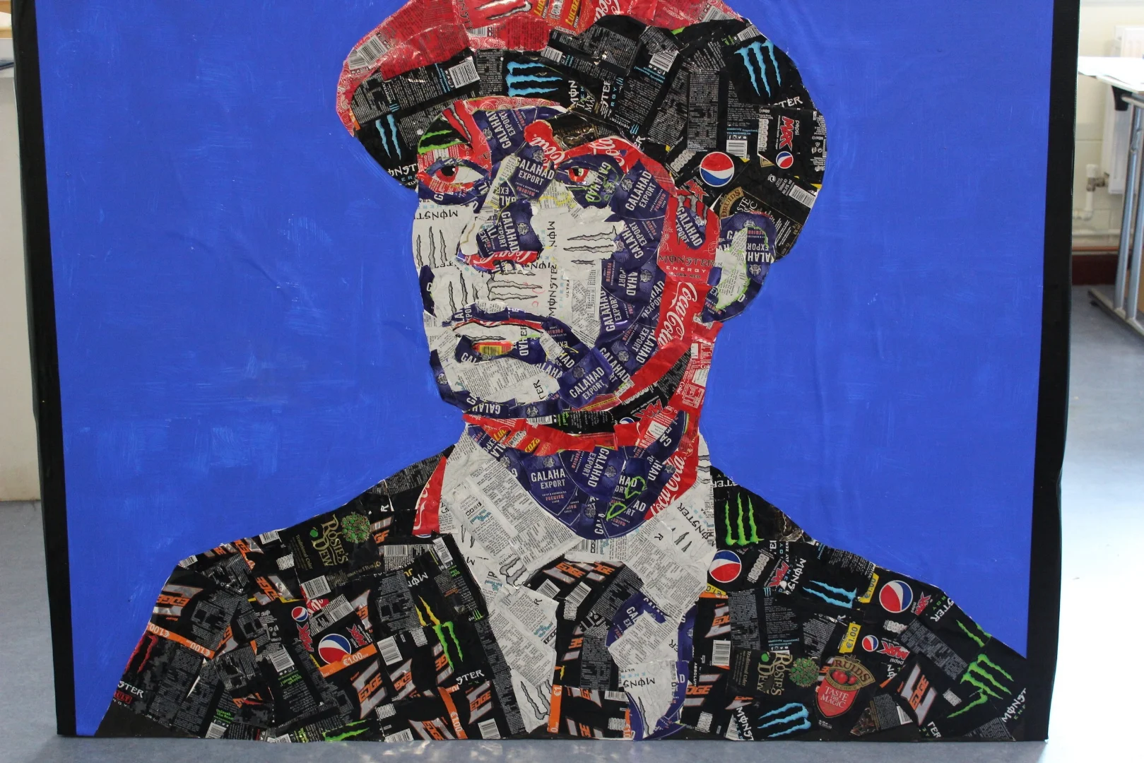 portrait by 5th art students made from recycled cans.JPG