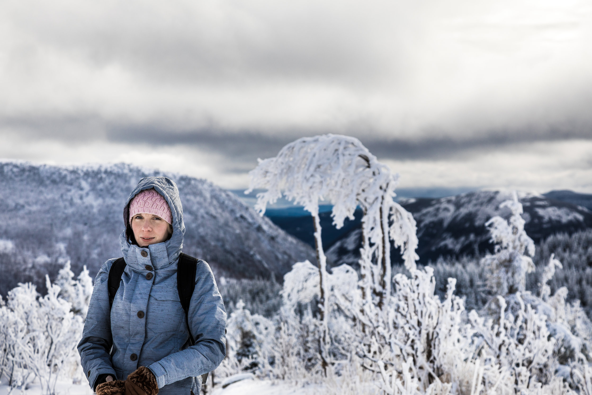 077656785-woman-hiking-high-mountains-du.jpeg