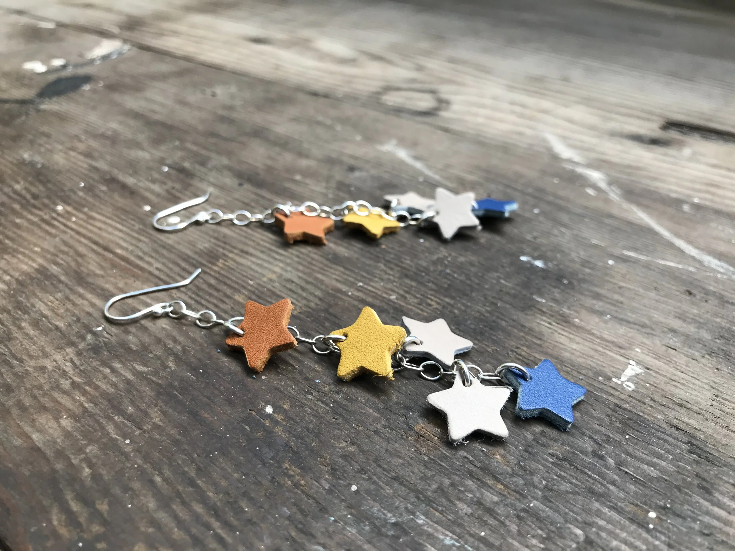 Earrings on silver chain with colorful leather stars