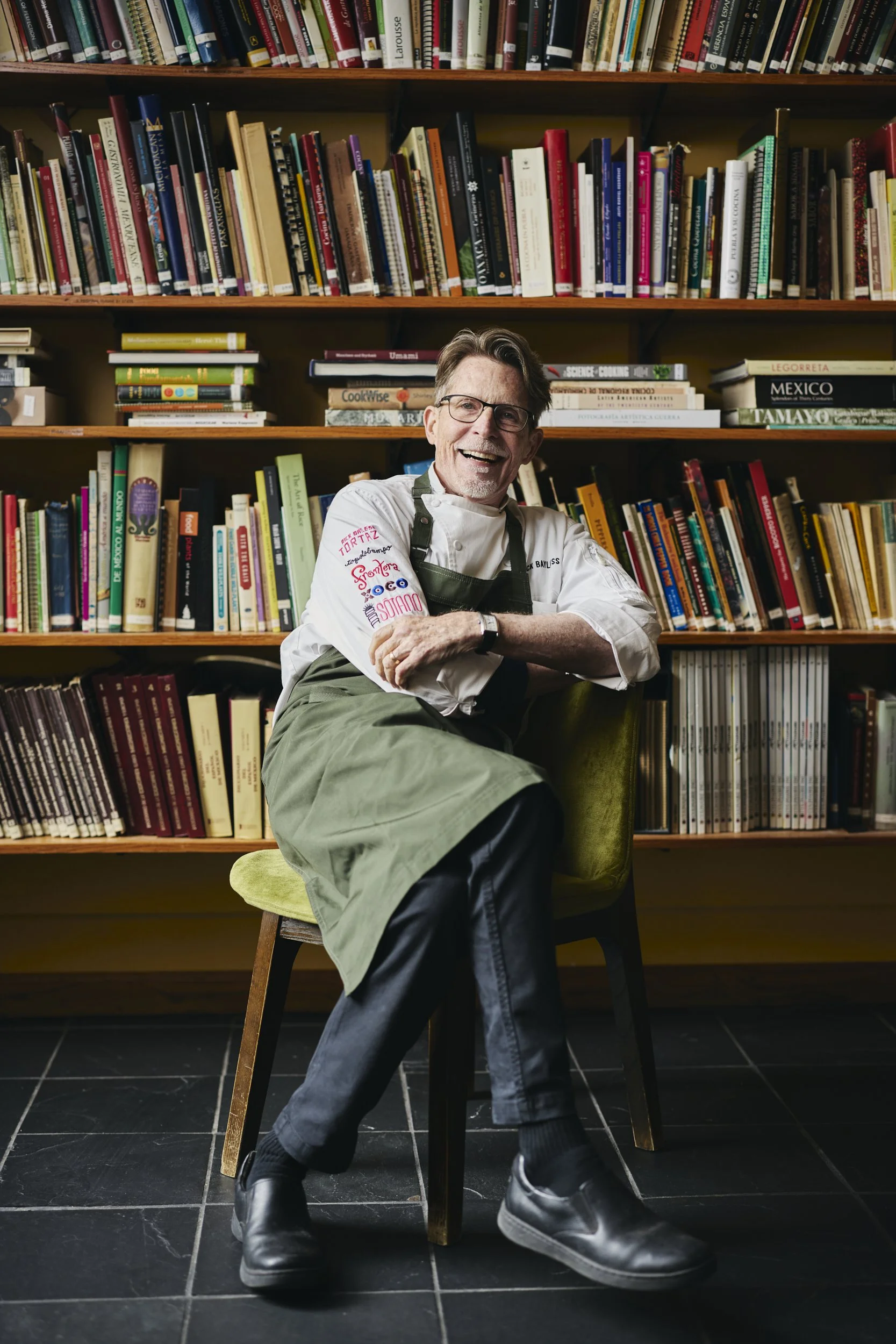 Rick-Bayless-Sitting-In-Front-Of-Bookcase.jpg