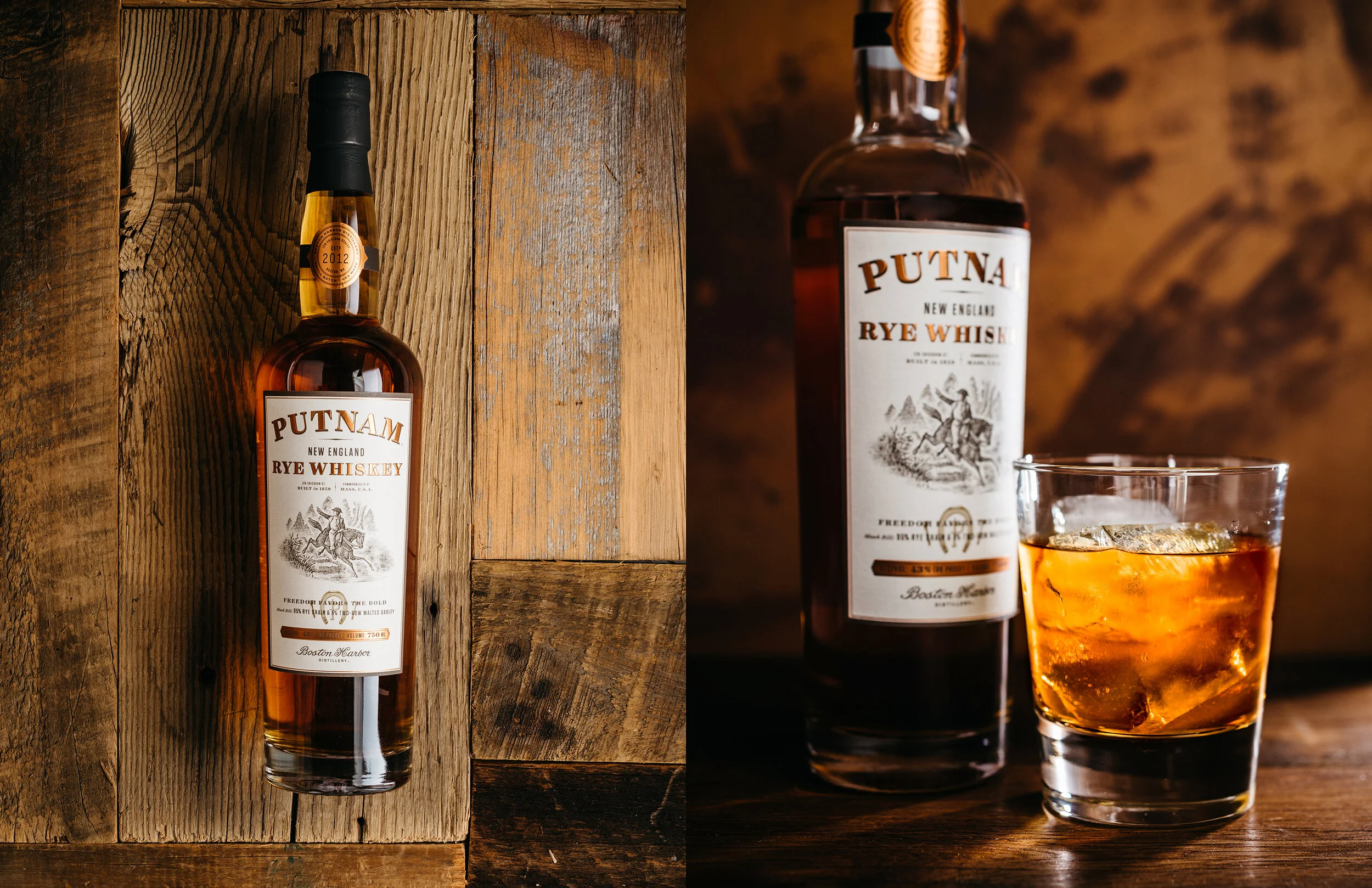 A bottle of Putnam New England Rye Whiskey placed on rustic wooden background, with a glass of whiskey and ice cubes beside it.