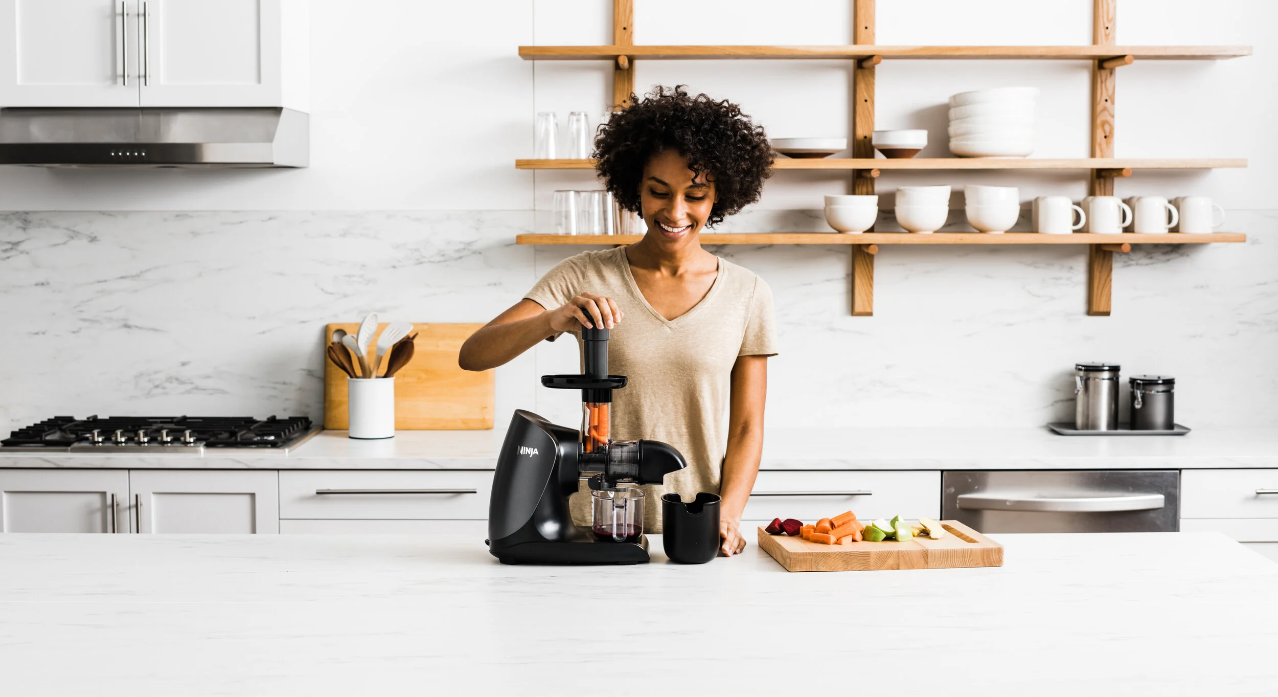 Woman-using-SharkNinja-Vacuum-Juicer.jpg