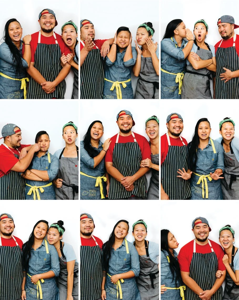 Group of people dressed as chefs posing together in a studio, showing various playful expressions and gestures.