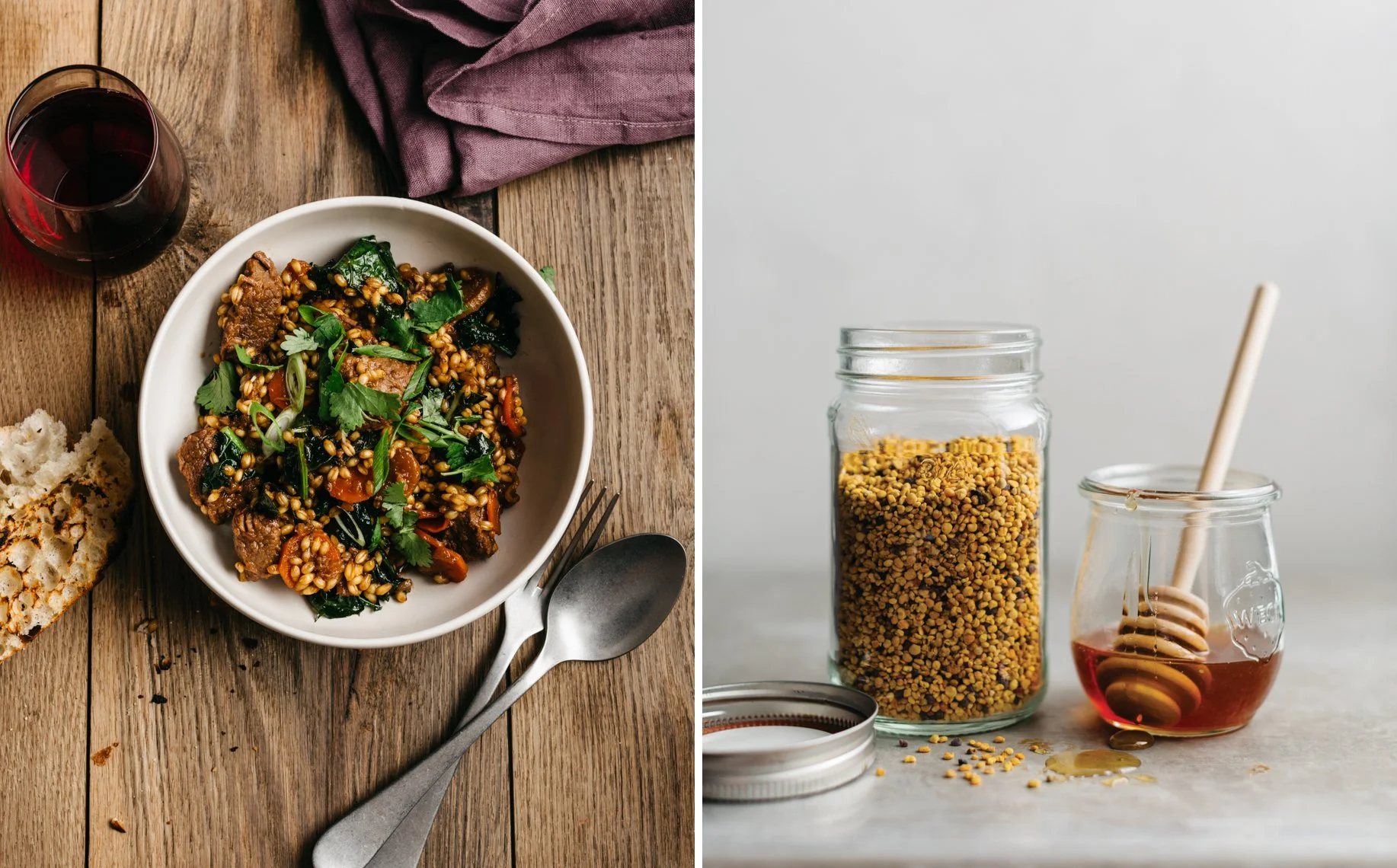A bowl of beef and vegetable barley soup with fresh herbs on a rustic wooden table, accompanied by a glass of red wine and bread. Next to it, a jar and a small jar of honey with a honey dipper on a grey surface.