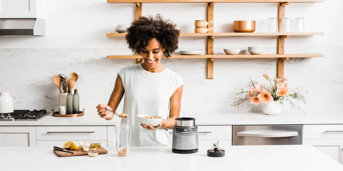 Woman-in-White-Kitchen-making-Smoothie.jpg