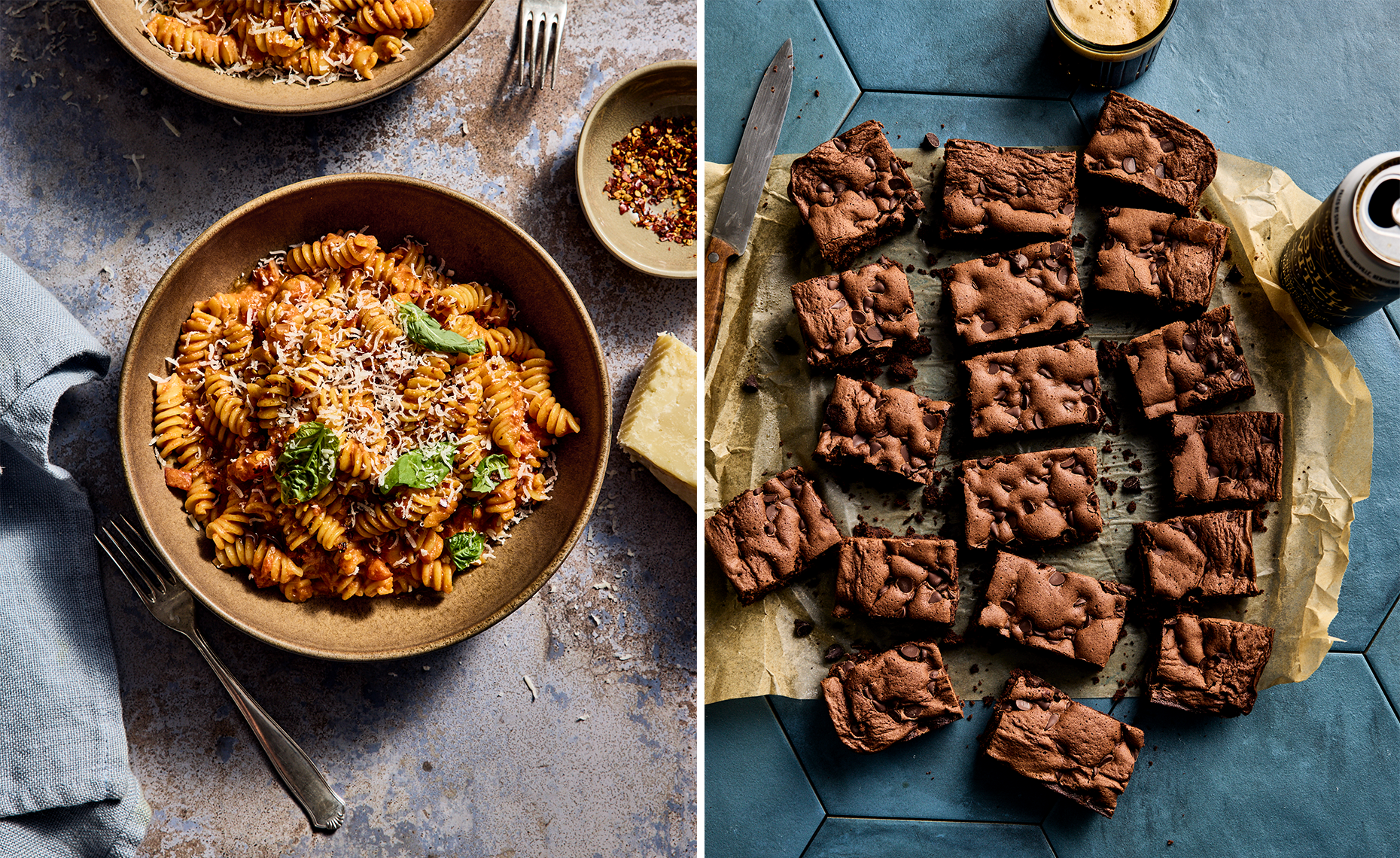 Left side: a bowl of cooked rotini pasta with tomato sauce, grated cheese, and basil, with a fork on a blue cloth napkin and a small dish of red pepper flakes; right side: chocolate chip brownies on parchment paper with a glass of milk and a soda can