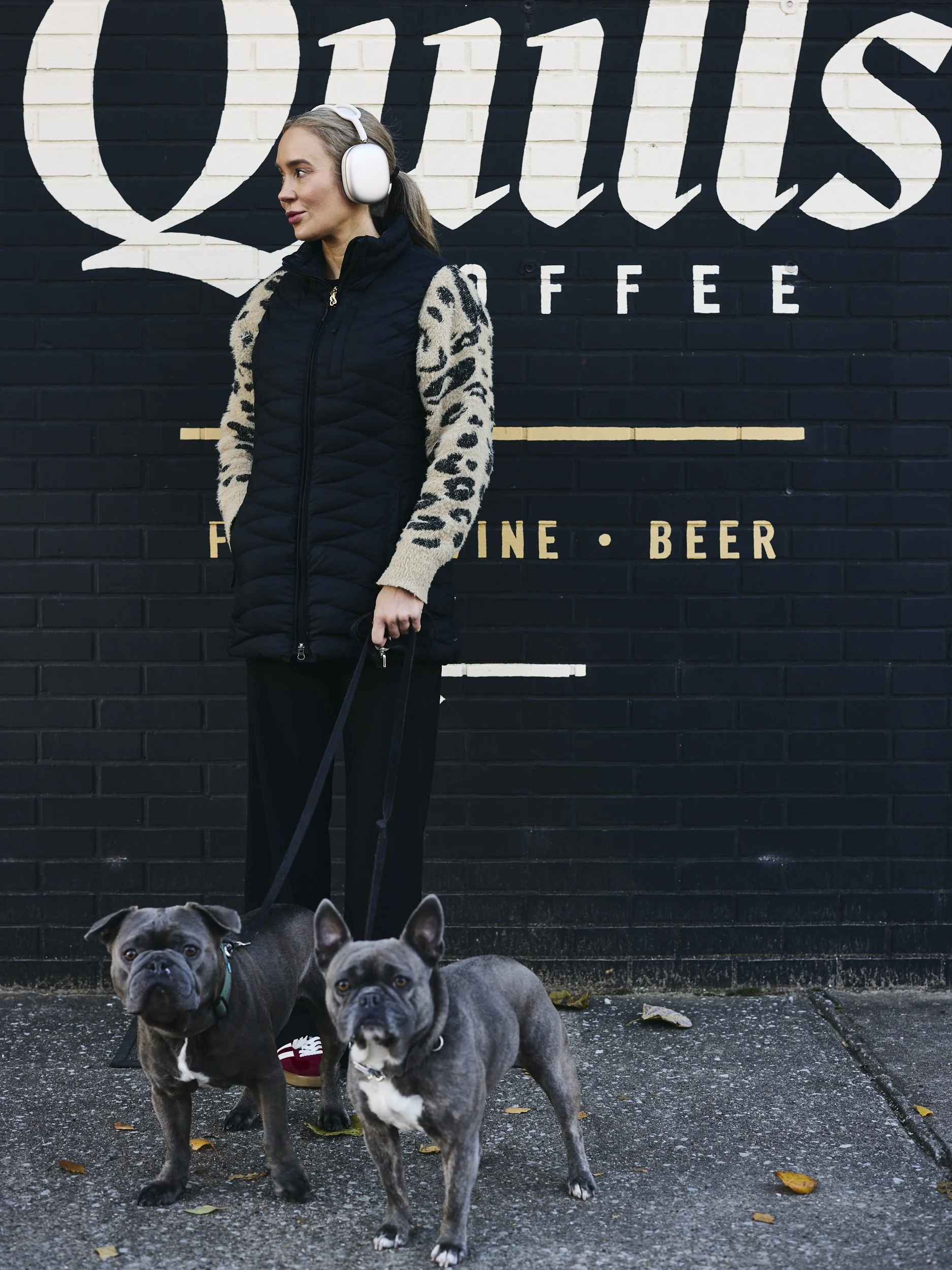 Woman-With-White-Headphones-Walking-2-Pugs.jpg