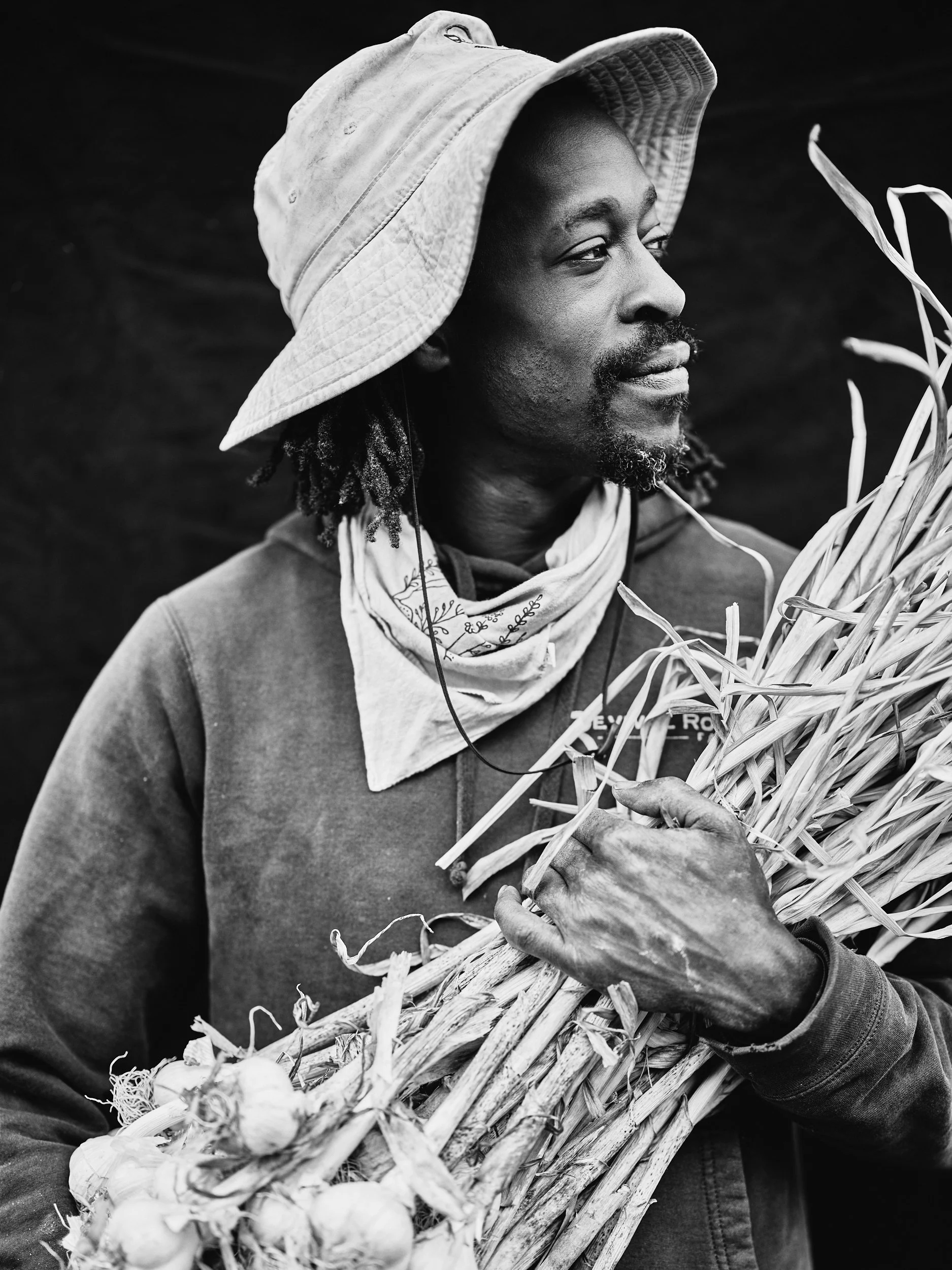 African-American Farmer holding garlic.jpg