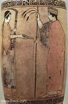 Demeter (right) holds a royal scepter and sheaf of wheat. Persephone (left), holds an Eleusian torch and pours libations from a cup.